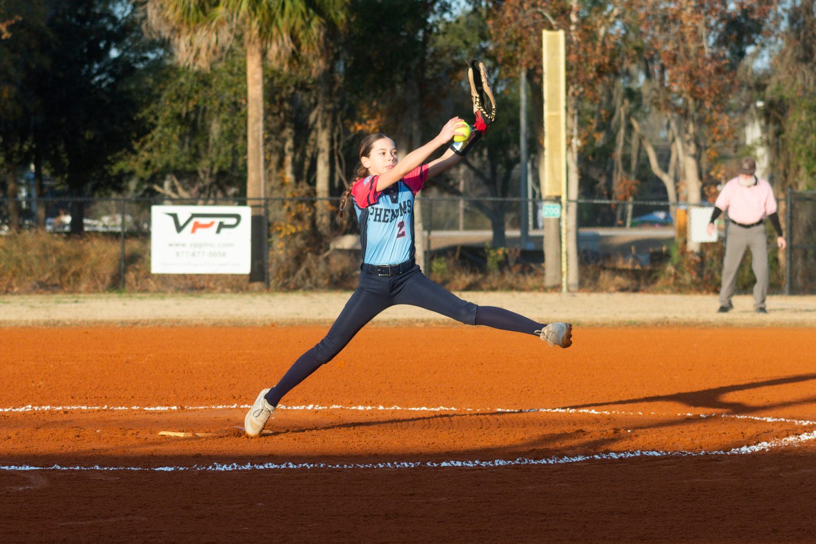 Camden at full stride in her windup on the pitching circle
