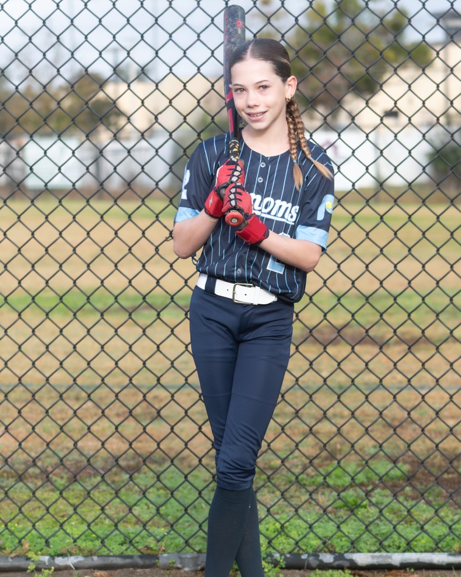 Camden Geary in uniform at the field, bat in hand